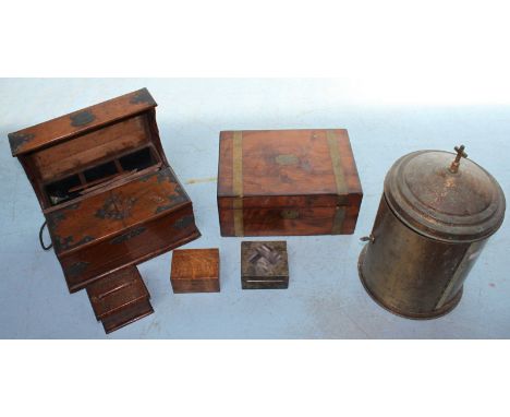 An unusual cylindrical brass cupboard of ecclesiastical interest, together with a brass bound, walnut writing slope, an oak d