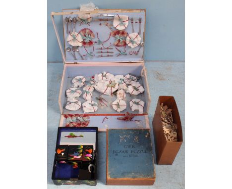 A child's tea set in original box, together with an Oriental lacquered musical trinket box, painted with scenes of trees and 