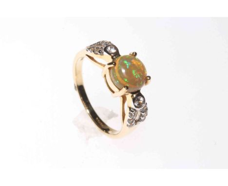 Opal and white Sapphire ring set in 9 carat yellow gold, size N½, with certificate.