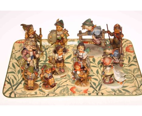 Collection of twelve Hummel figures including Skier, Apple Tree Boy &amp; Girl, two Little Goat Herders and On Secret Path.