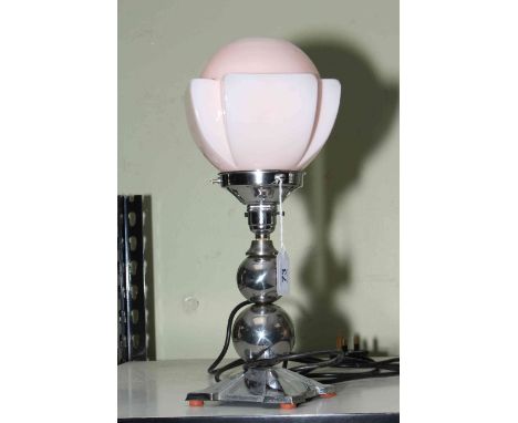 Art Deco style table lamp with pink shade.