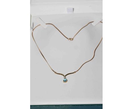 Aquamarine and diamond pendant on 9 carat gold chain.