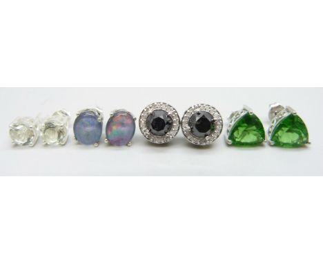 Four pairs of silver stud earrings set with black and white diamonds 4.00ct, green amethyst 2.25ct, helenite 5.50cts and Aust