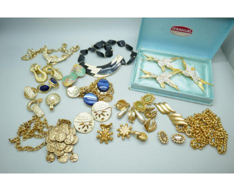 A collection of gold tone vintage jewellery including Monet earrings, Trifari necklace and earrings, and three Coro Craft sty