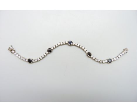 A cubic zirconia set silver tennis bracelet, 19.3cm