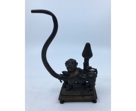 An unusual 19th century Indian bronze and parcel gilt pipe, fashioned as half lion half man, height 18.5cm.
