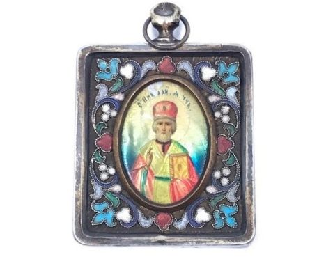 An early 20th century silver and enamel Russian pendant Icon, stamped 1908-1917 84 zolotnik mark, having central oval half le