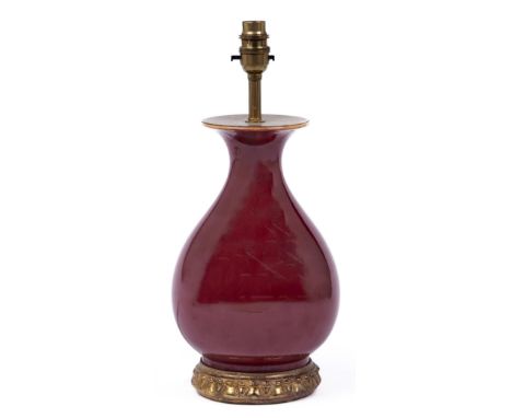 A brass mounted flambe glazed porcelain lamp, 20th c, 28cm h excluding fitment  Good condition