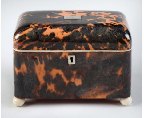 A Victorian tortoiseshell tea caddy, with silver escutcheon and tablet, wire stringing and ivory feet, the divided interior r