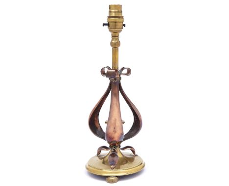 An English arts and crafts early electric brass and copper table lamp, early 20th c, 28cm h excluding later fitment  Old poli