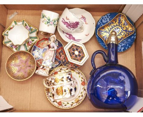 A Meissen cup and saucer, decorated with the dragon design in puce and red, a Coalport Japanese Grove pattern pin tray, Royal