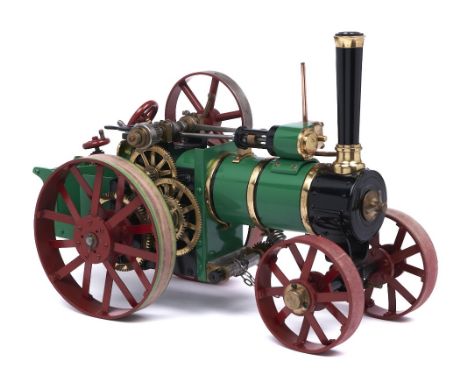 A scratch built brass and ferrous metal model traction engine,&nbsp;painted green, black and red, overall length 40cm  In app
