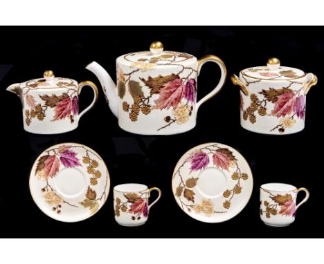 A Wedgwood bone china tea service for two, late 19th c, enamelled with naturalistic foliage and raised gilt berries, the serv