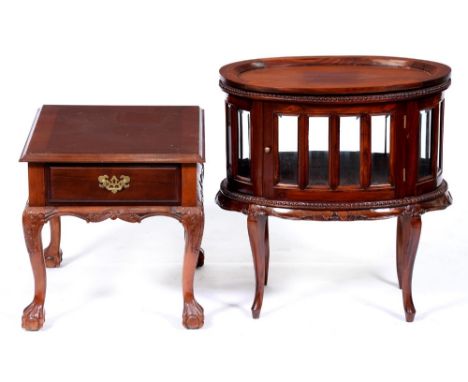 An oval carved and mahogany stained drinks cabinet and detachable tray, 77cm h; 48 x 72cm and a similar table on cabriole leg