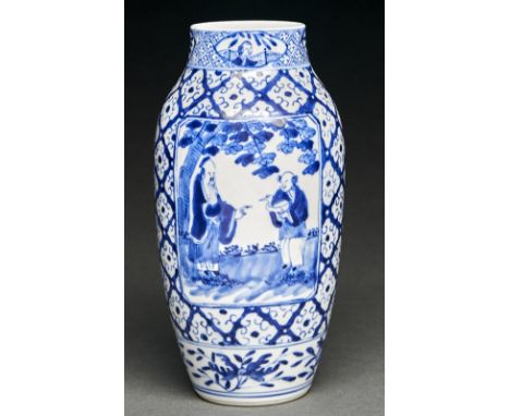 A Chinese blue and white vase, late 19th c, painted to either side with two figures, one holding a bird, 23.5cm&nbsp; h, Kang