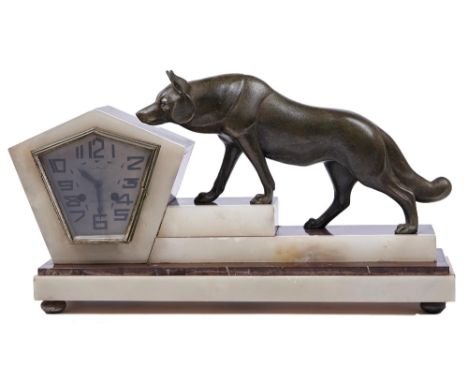 A French art deco marmo griotte rouge, onyx and spelter mantel clock, with silvered kite shaped dial, the stepped base set wi