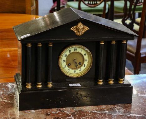 A striking slate mantel clock of architectural form, with fluted column supports, late 19th century