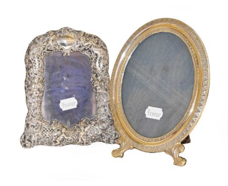 A Victorian Silver Photograph-Frame, by William Comyns, London, 1896, shaped oblong, the sides with openwork foliage scrolls 