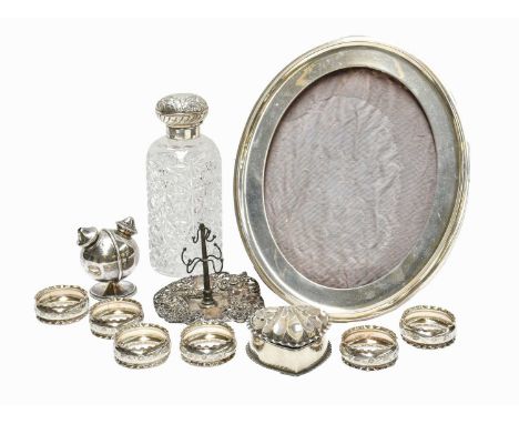 A Collection of Assorted Silver, including: a silver-mounted cut-glass scent-bottle, 16.5cm high; a silver-mounted oval photo