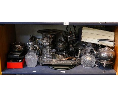 A large quantity of assorted silver plated items, including a canted rectangular gallery tray, claret jugs, two spirit kettle