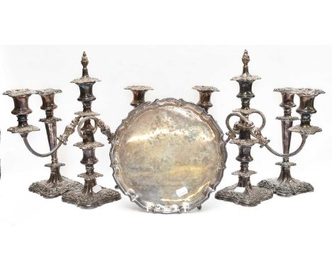 A pair of silver plated three branch candelabra, a matching pair of table candlesticks, a silver plated salver, an eight plac