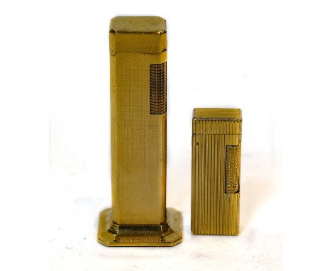 A Dunhill Gold Plated 'Tallboy' Lighter, with engine-turned finish and on spreading base, 11cm high; Together With: a Dunhill