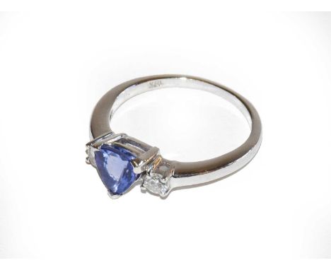 An 18 carat white gold tanzanite and diamond three stone ring, finger size O1/2Condition report: Gross weight 3.6 grams.&nbsp