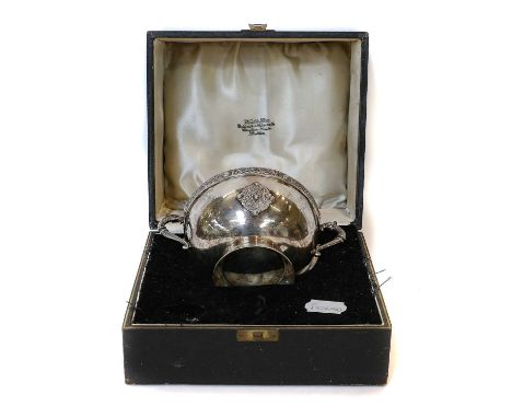 An Irish Silver Bowl, by West and Son, Dublin, 1933, hemispherical and on spreading foot, the rim and handles cast with Celti