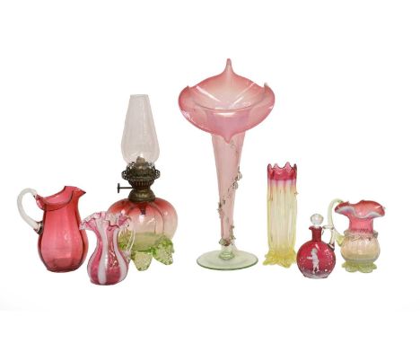 A quantity of Victorian cranberry and vaseline glass items, including an oil lamp, Jack in the Pulpit vase, Mary Gregory enam