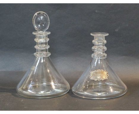 A Matched Set of Four Glass Ships' Decanters and Three Stoppers, with bull's eye knops and triple ring necks, 28cm highCondit
