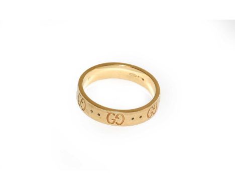 A Gucci band ring, stamped '750', finger size K1/2Condition report: No box. Gross weight 3.7 grams.