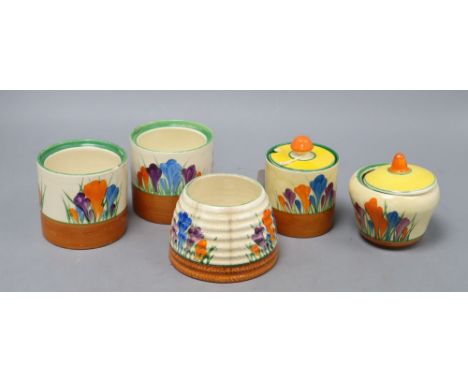 Five Clarice Cliff crocus preserve jars and two covers, tallest 8.5cmCONDITION: The beehive shaped pot has 2 large hairline c