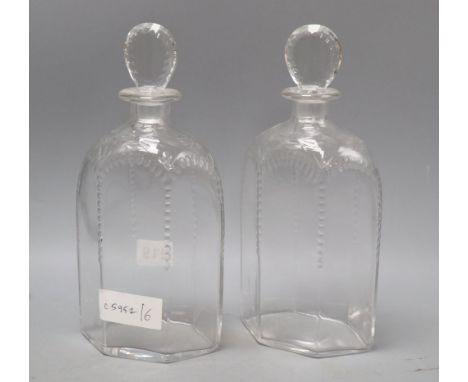 A pair of James Powell Whitefriars hexagonal half-cut glass decanters and stoppers, height 25cmCONDITION: Both stoppers have 