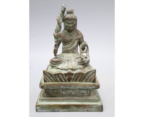 A Himalayan bronze seated figure of a deity, height 16cm