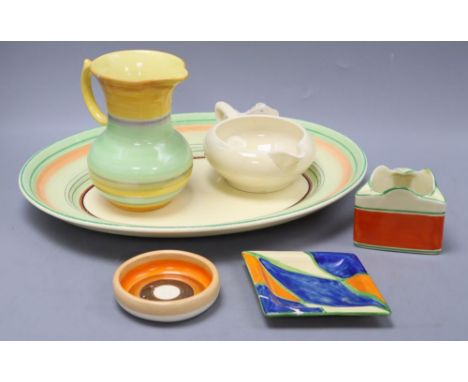 Four pieces of Clarice Cliff, a Shelley jug and one other