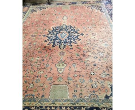 A Tabriz red ground carpet, 470 x 410cm