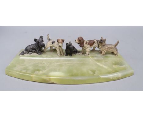 A cold painted bronze dish, modelled with terriers and a spaniel, length 36cm