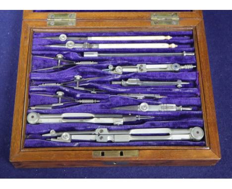 A Victorian Army and Navy set of draughtsman instruments and rules, walnut cased