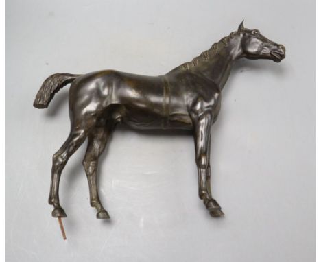 A late 19th/early 20th century bronze figure of a horse, height 30cm, lacking base