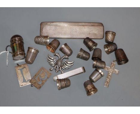 A group of silver thimbles, an engine turned silver comb and case, etc.