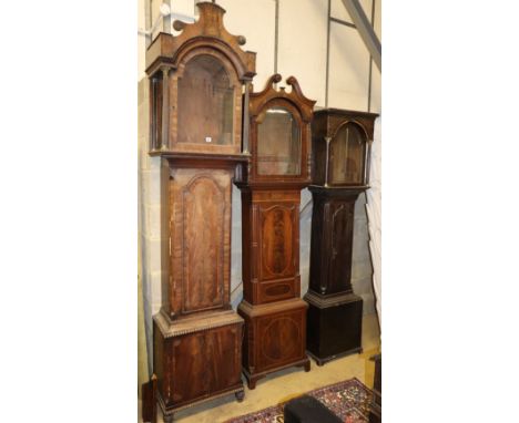 Three George III mahogany and oak longcase clock cases, largest W.56cm, D.34cm, H.254cm