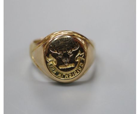 An 18ct signet ring, carved with the Seaforth Highlanders crest and motto, size L, 10.7 grams.CONDITION: Two small stress cra