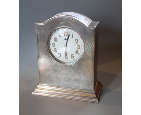 A George V engine turned silver mantel timepiece, W.G. Sothers Ltd, Birmingham, 1921, height 14cm.CONDITION: A few minor knoc