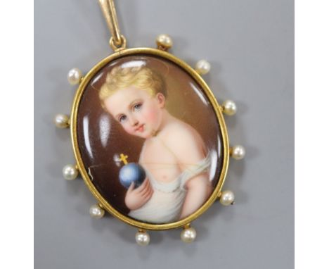 A late 19th century yellow metal and seed pearl mounted oval painted enamel panel pendant, inscribed en verso 'L'Enfant Jesus