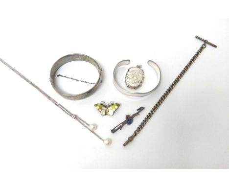 A 9ct gold pendant, mounted with a circular cut diamond, a gold and lime coloured green paste set pendant, a pendant mounted 