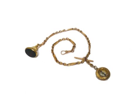 A gold watch Albert chain, in a twisted bar and knot link design, fitted with a gold T bar, two gold swivels, a compass penda