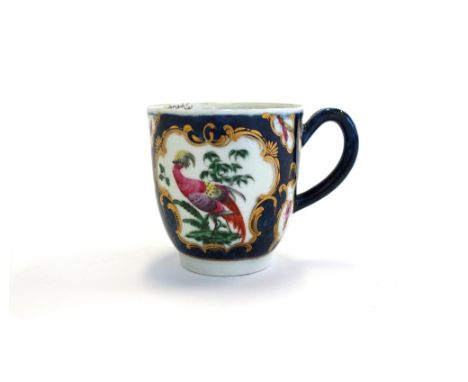 A Worcester coffee cup, circa 1770, painted with exotic birds and insects within gilt-edged mirror and vase shaped panels aga