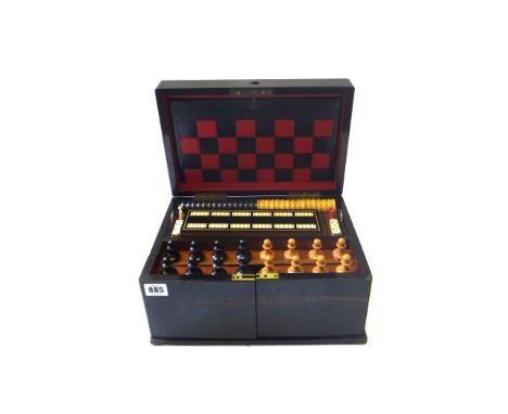 A Victorian coromandel games compendium, the hinged lid and doors opening to reveal a chess set, checkers, and four sets of p