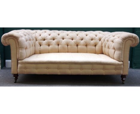 A Victorian button back Chesterfield sofa on turned mahogany supports, 186cm wide.