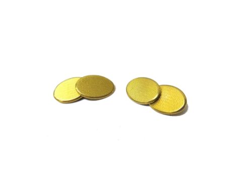A pair of 18ct gold cufflinks, the oval backs and fronts having engine turned decoration, Birmingham 1958, weight 19.7 gms.